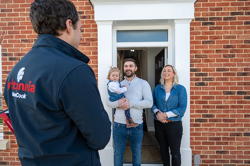 A happy family thanking one of our removals managers following another successful house move