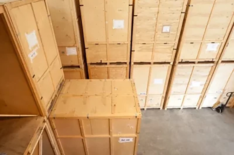 Britannia Alan Cook Removals & Storage labelled and stacked wooden storage crates in the Loddon storage facility