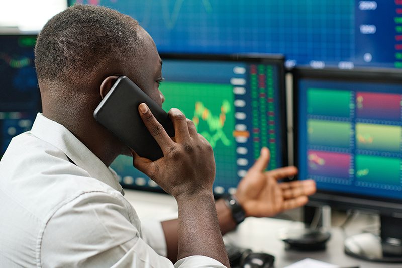 Young African American Broker At Work