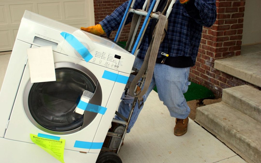 A washing machine being delivered using a special trolley capable of navigating steeps