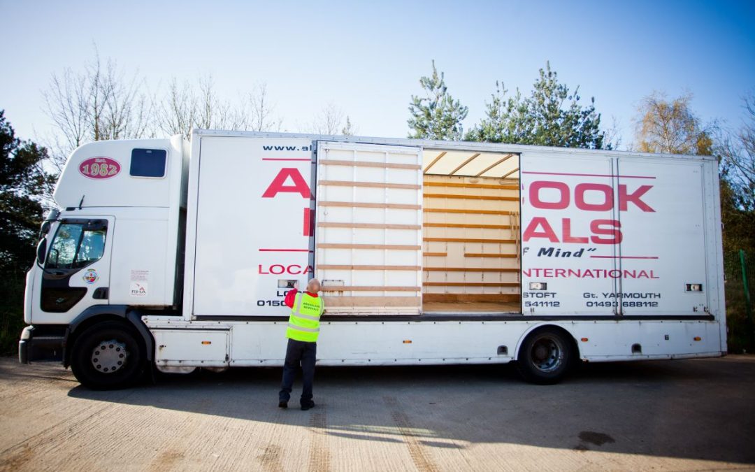 On of our removals team opening the side doors of a lorry to start loading