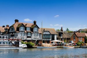 The Swan Hotel in Horning, Norfolk with river frontage, broads cruiser, sailing boats and river trip paddle boat