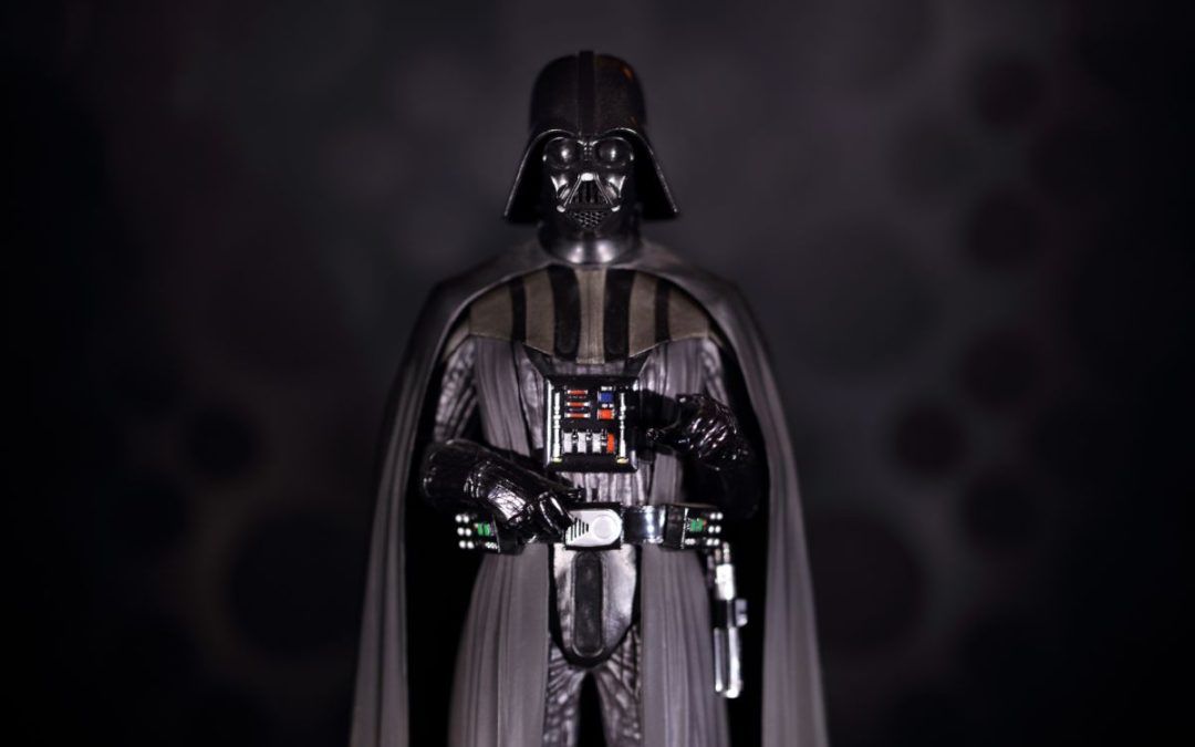 A creatively lit Darth Vadar character against a dark background