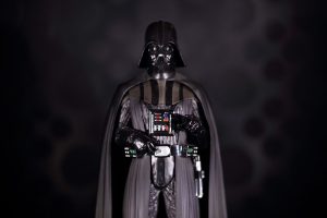 A creatively lit Darth Vadar character against a dark background