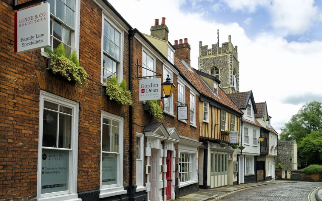 A row of historic terraced buildings in the city of Norwich
