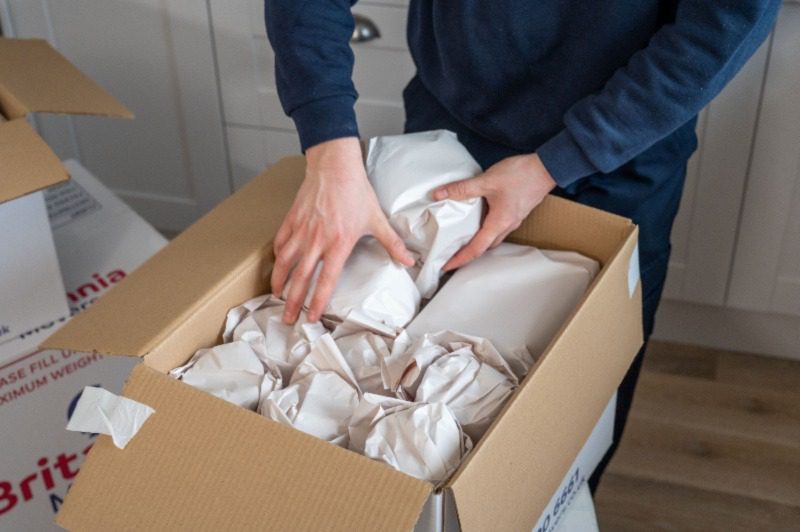 Image depicting packing supplies such as boxes, tape, and bubble wrap, symbolizing the preparation