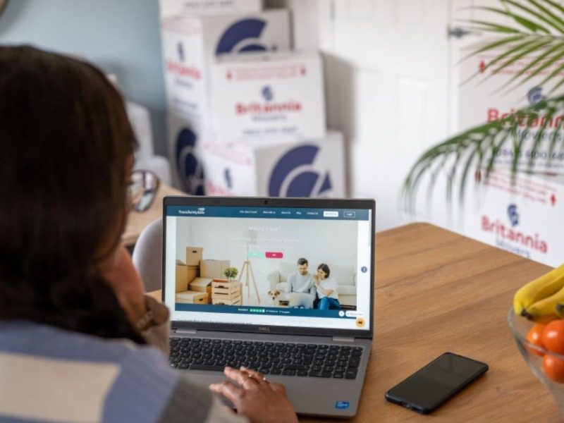 A client looking at our TransferMyBills service on her laptop computer