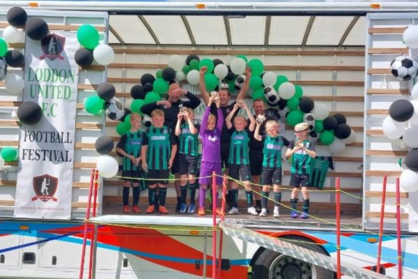 Loddon youth football team celebrating on one of our removals lorries