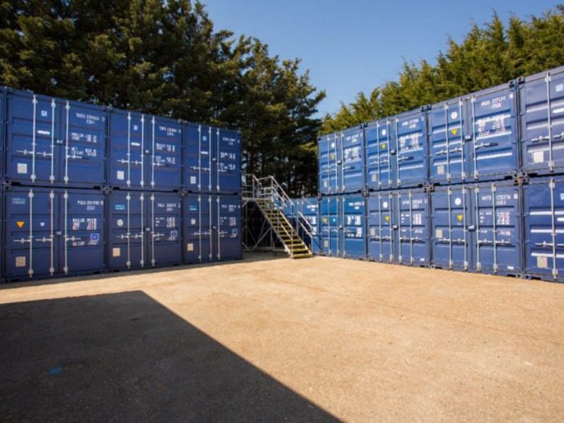 Stacked Containers Place 3 Outdoor secure containerised storage units with movable access platform